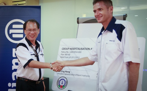 National Union Bank Employees President, Tan Eng Hong and Allianz Life Insurance Malaysia Chief Executive Officer, Jens Reisch shaking hands after the signing ceremony 1