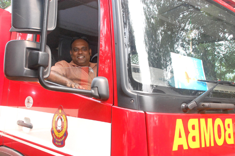 Jeyaseelen sitting in the driver's seat