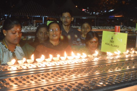 Devotees placing the lamps on the rack