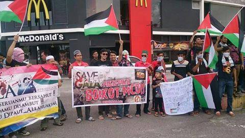 Demonstaters with banners in a protest which turned ugly