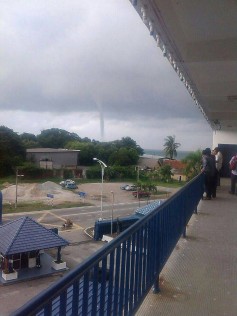 Curious onlookers from Port Dickson police station