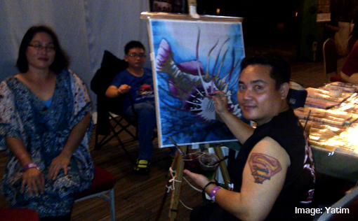 Asia Music Festival 2014 Miri Local painter at work