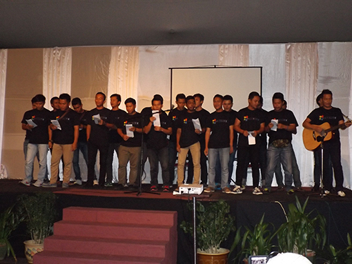 Trainees performing on stage