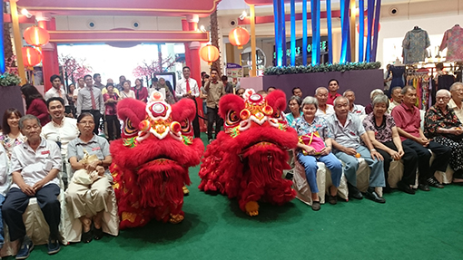 The lions bringing cheer and mingling with the senior citizens of Sungai Way Old Folks Home.