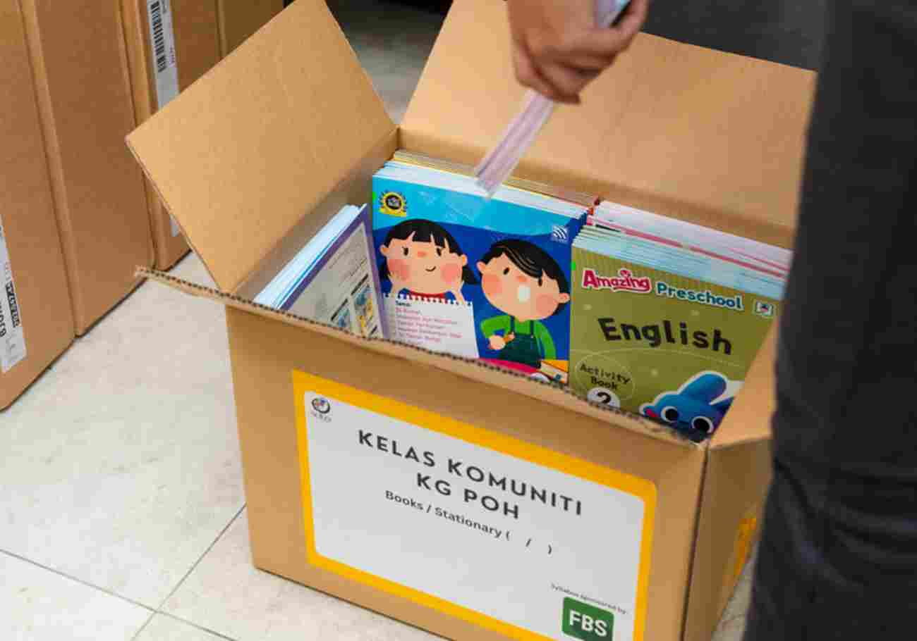 FBS and SUKA Society vVolunteers diligently prepare educational materials for Orang Asli preschools, fueled by collaboration and a commitment to equity.