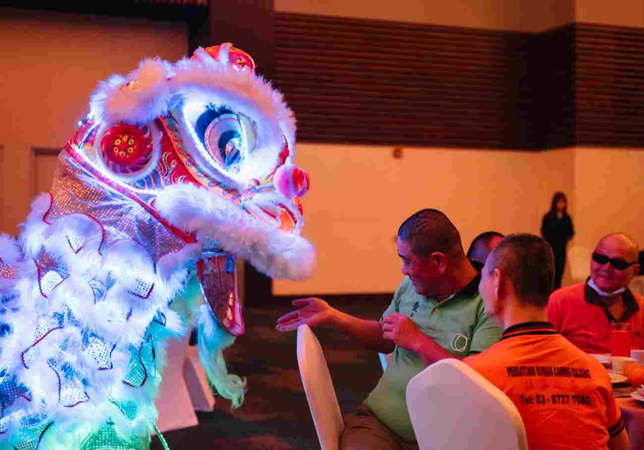 Vibrant decorations and happy crowds at IOI Mall, celebrating the "Leap of Spring" Chinese New Year with exciting activities, performances, and special offers. 