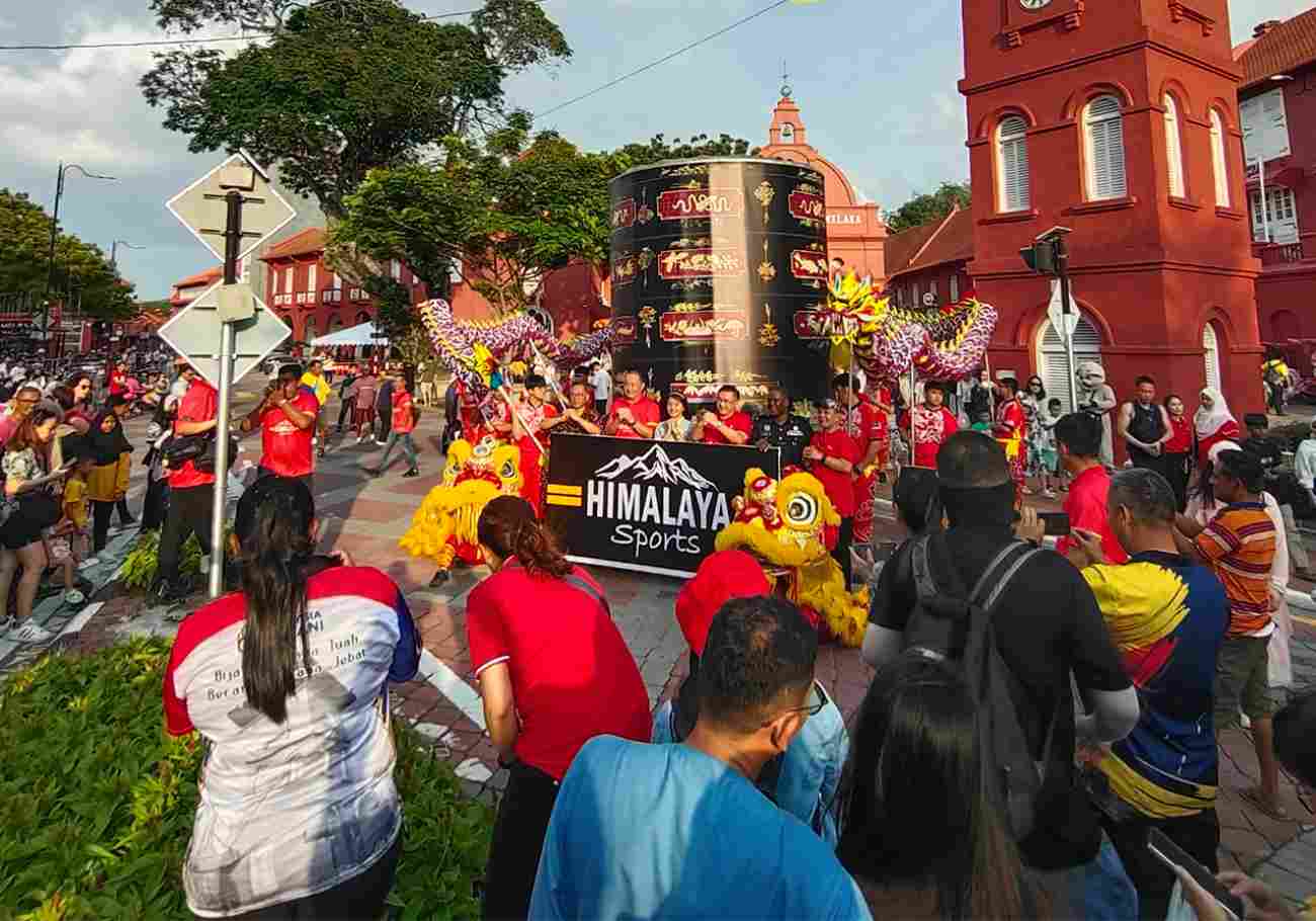 Visitors marveling at the illuminated decorations and unique atmosphere of Jonker Walk during CNY.